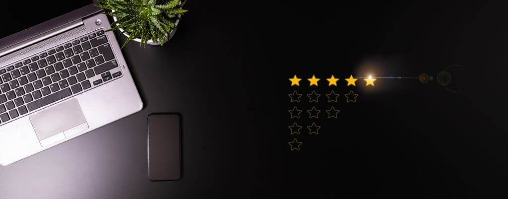 Stars depicting a positive rating next to a laptop computer